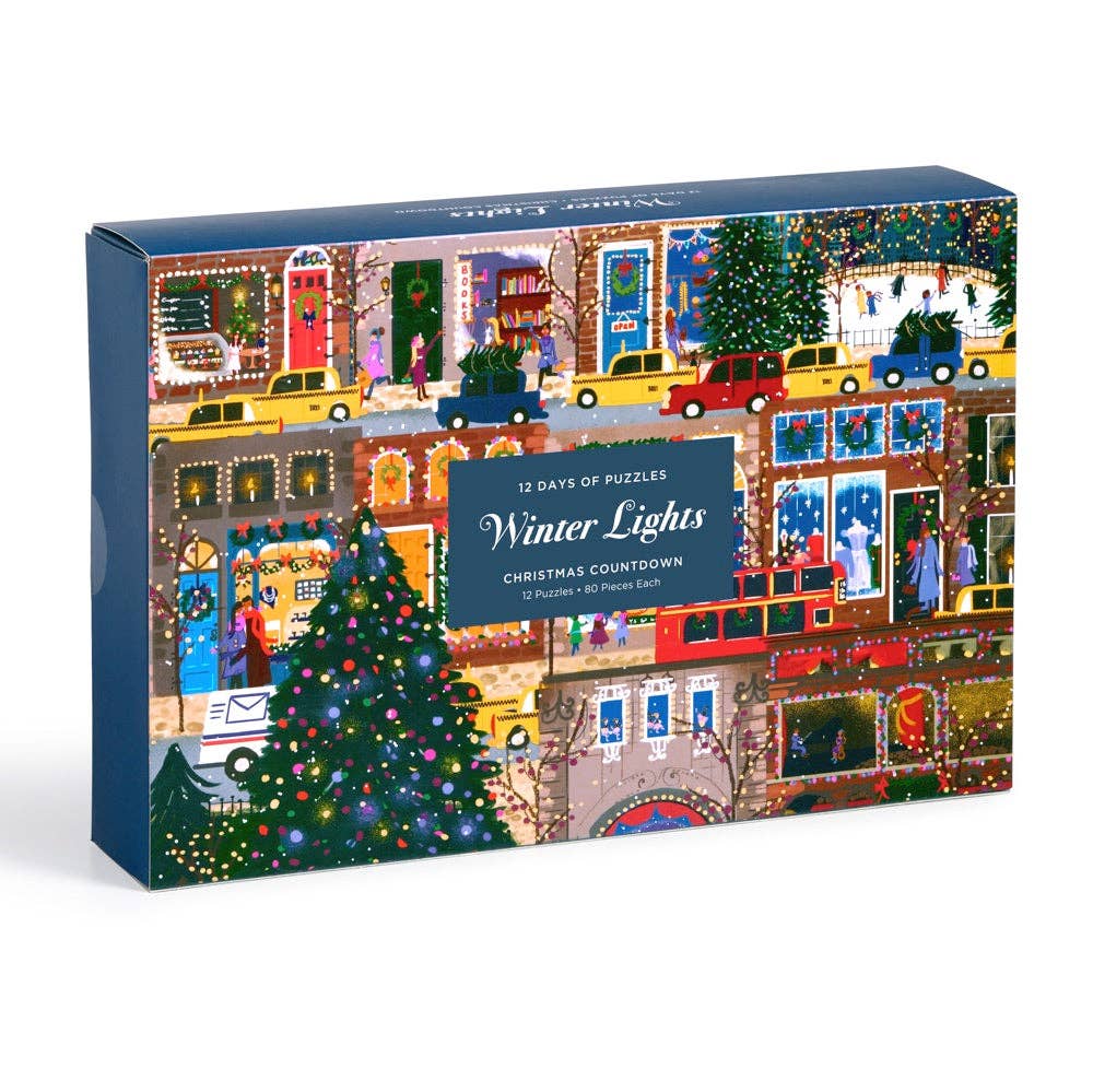 Box of '12 Days of Puzzles Winter Lights' Christmas countdown puzzle set on a white background