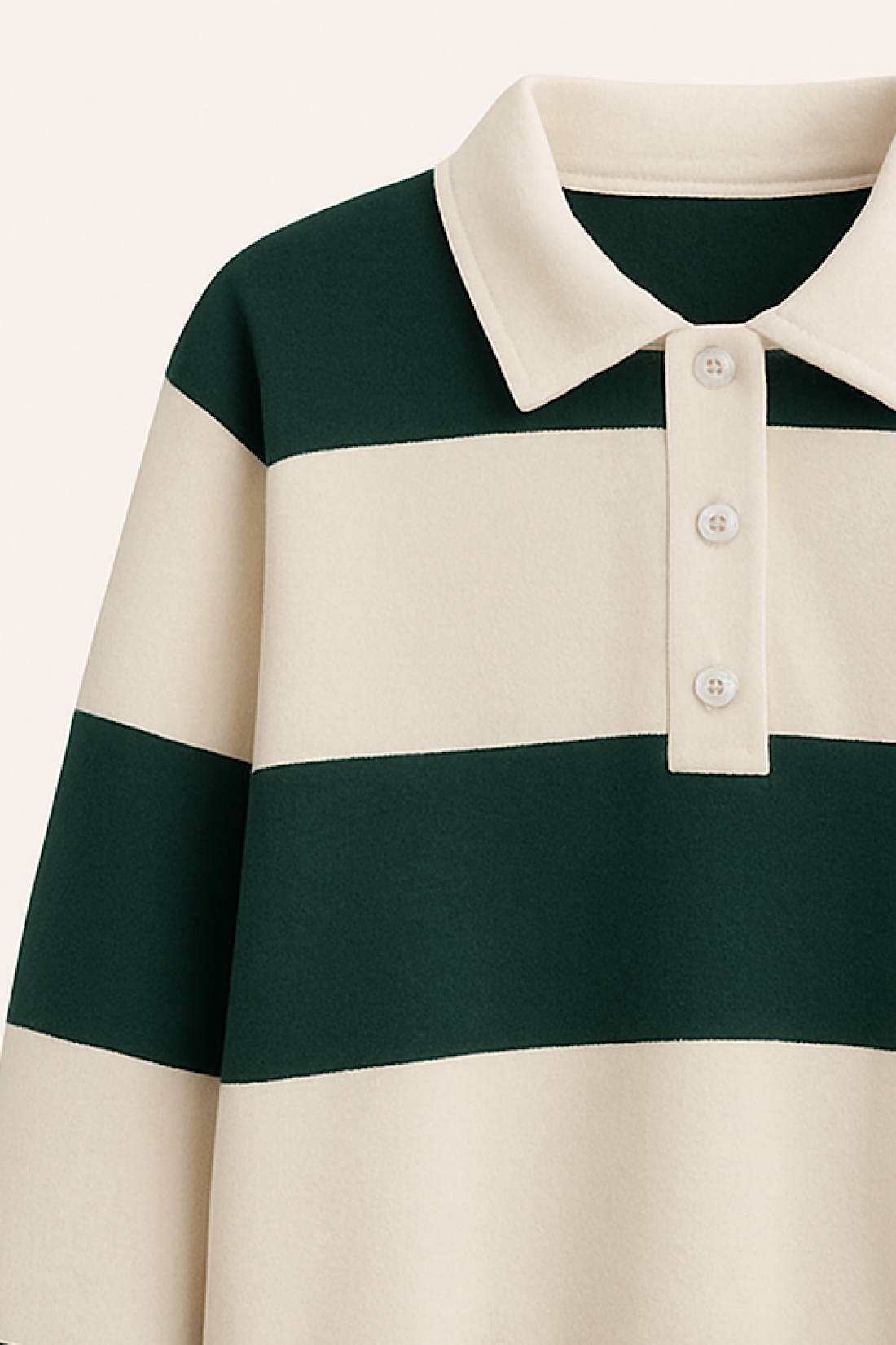 Close-up of a green and beige striped polo shirt on a white background