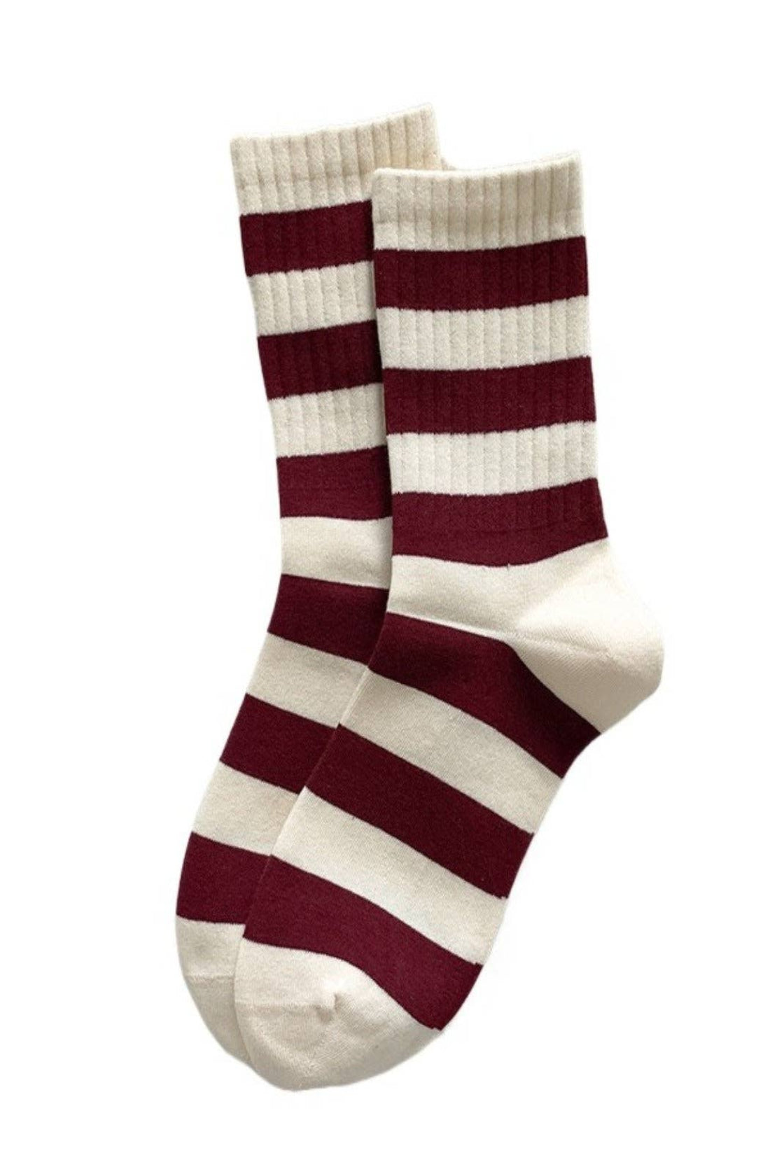 Pair of red and white striped socks on a white background