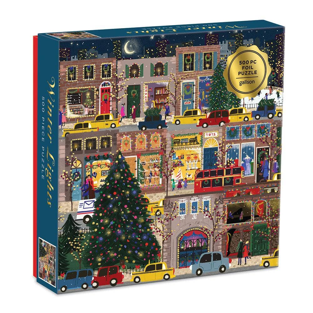 Jigsaw puzzle box with a festive street scene design, featuring a Christmas tree and buildings.